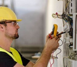 Electrician checking wiring